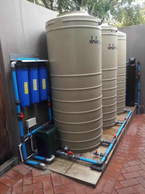 Water storage tanks, filtration and pressure pump installation